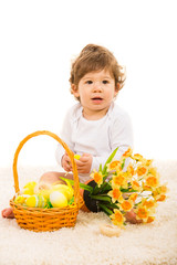 Baby boy with Easter eggs