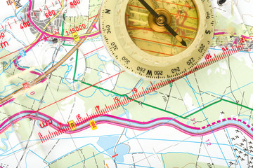 old touristic compass on map