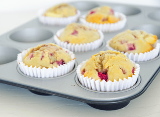 Homemade strawberry muffins in paper cupcake cases