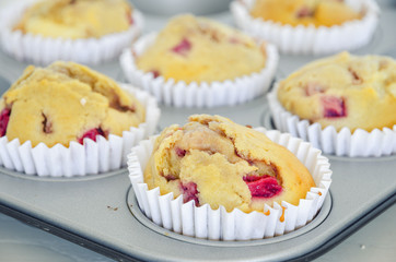 Homemade strawberry muffins in paper cupcake cases