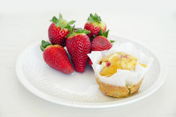 Homemade strawberry muffins in paper cupcake cases
