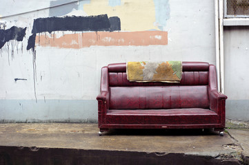 Old abandoned couch dumped on the street