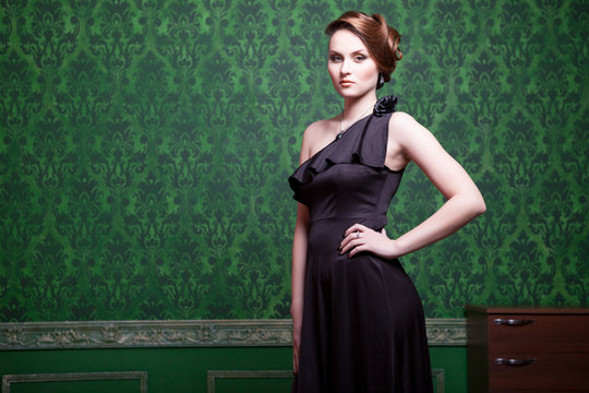 Woman In Evening Dress In Vintage Room