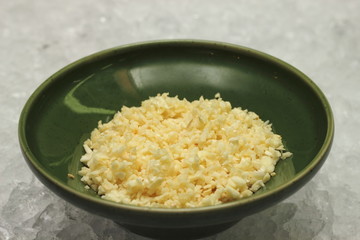 minced garlic in a green bowle on ice