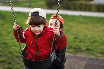 Little boy swinging