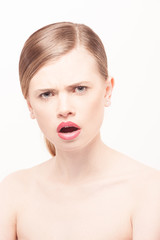 Portrait of beautiful young woman with clean face. High key shot