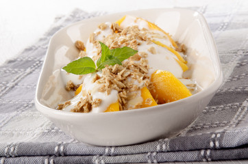yogurt with mango piece and cereals