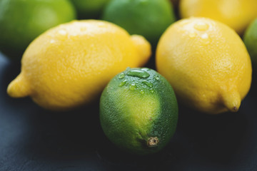 Close-up of ripe lemons and limes, horizontal shot