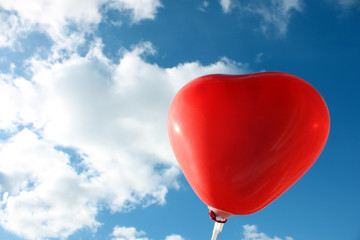 Fototapeta na wymiar Heart-shaped baloons in the sky