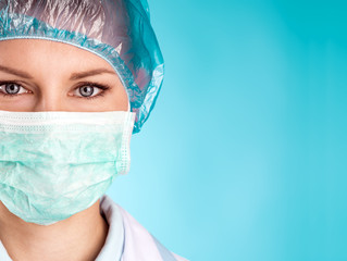 Close-up of female surgeon face with space for text