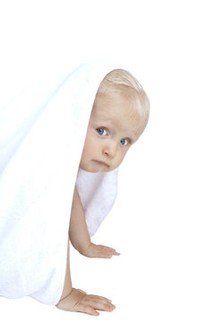 Baby behind towel
