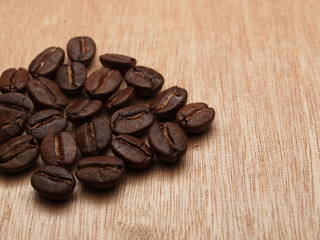 Roasted Coffee Beans on wood texture table