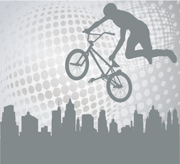 Fototapeta na wymiar bmx cyclist silhouette on the abstract background - vector