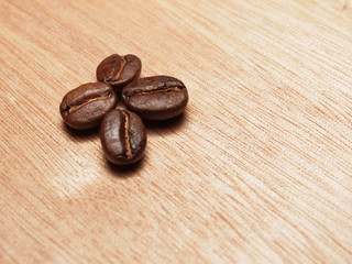 Roasted Coffee Beans on wood texture table