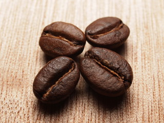Roasted Coffee Beans on wood texture table