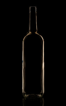 Glass bottle in the low-key lighting