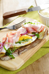 Bacon and fried eggs open sandwich
