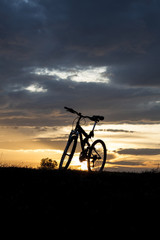 Fototapeta na wymiar Evening recreation with bicycle