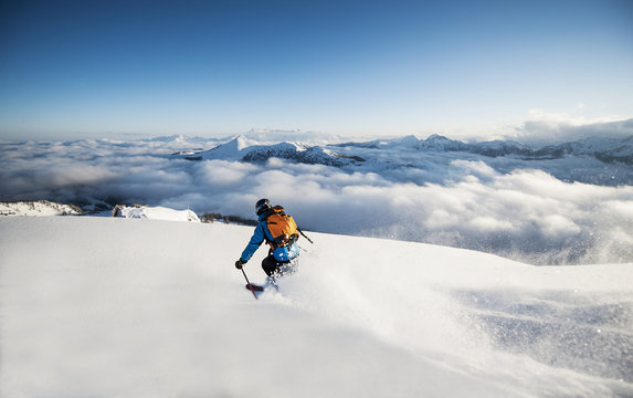 Austria, Salzburg, Mid adult man skiing in mountain of Altenmarkt Zauchensee