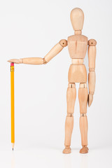 Small wood mannequin standing with colour pencil isolated on whi