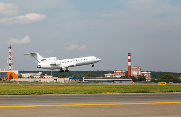Fototapeta premium white plane takes off