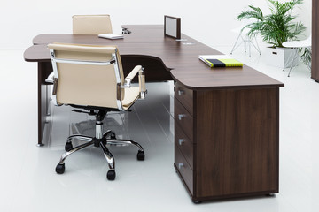 desks and leather chairs