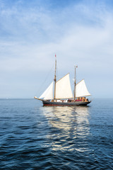 Tall ship on blue water vertical