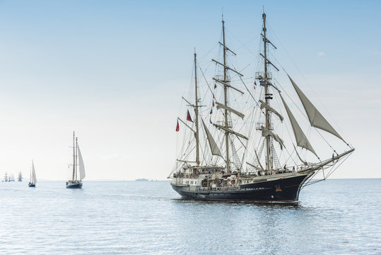 Fototapeta Tall ship on blue water horizontal