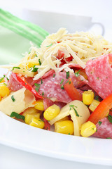 Salad with salami, cheese, paprika and sweet corn