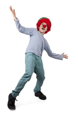 boy with clown nose and hat isolated on white background