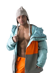 Attractive young male skier or snowboarder with open coat