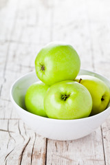 ripe green apples in bowl