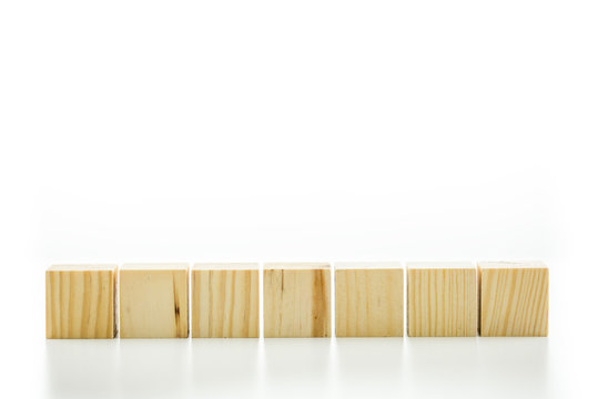 Seven blank wooden blocks