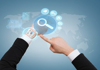 businessman pointing to virtual watch at his hand