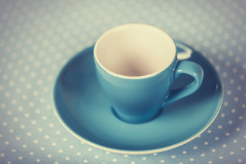Cup of a coffe on polka dot cover