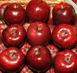 Background with fresh red apples on the market