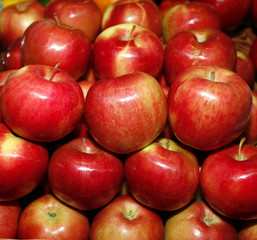Background with fresh red apples on the market