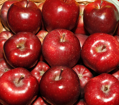 Background with fresh red apples on the market