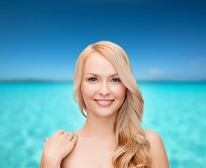 face and shoulders of happy woman with long hair