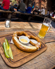 Bavarian style pretzel and ale in beer garden