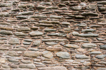 Medieval irregular stone wall background