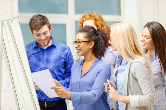 smiling business team having discussion in office