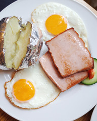 Traditional german dish with meat,fried egg and baked potato