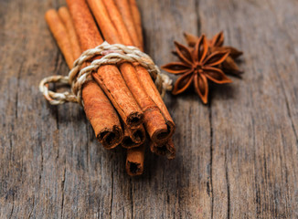 Cinnamon  on wood background