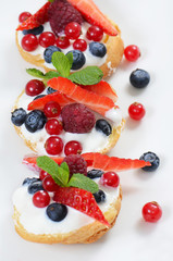 Profiteroles with berries currant  and blueberries
