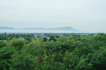 Village and mountains on the horizon at sunrise. Thailand