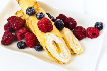 Delicious pancakes with curd and berries