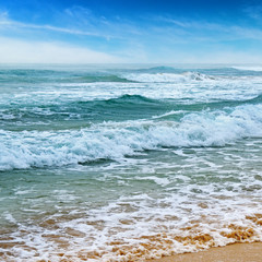 seascape, sand beach and blue sky
