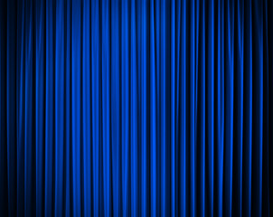 blue closed curtain with light spots in a theater