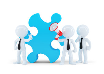 Team of business people and piece of a puzzle